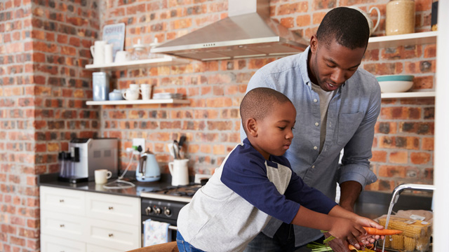 dad teaching son how to be self sufficient