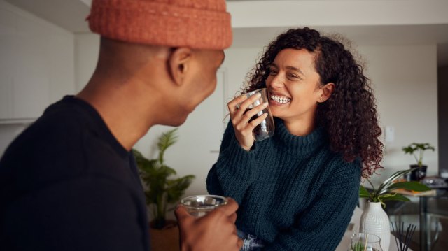 couple laughing together in the kitchen