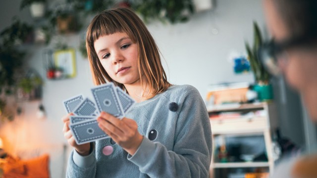 little girl practicing an easy magic trick