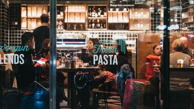 family in restaurant through window