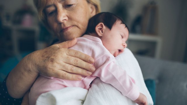 grandma holding baby grandchild