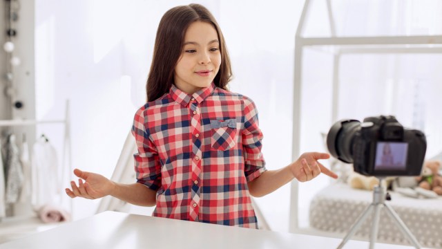 little girl learning how to create a youtube channel