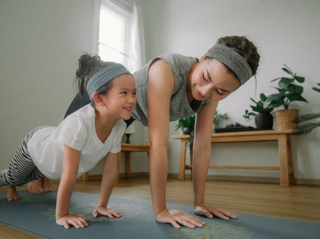 a mother and her toddler daughter working out together, one of our favorite indoor games