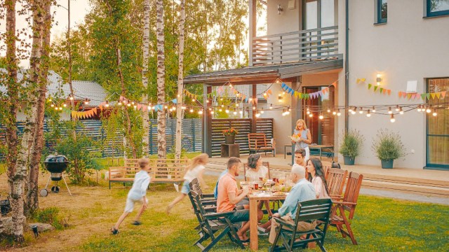 family enjoying backyard meal