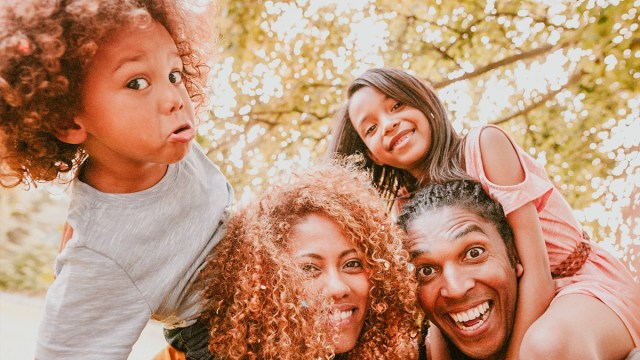 a family posing making silly faces which is one of the best family photo ideas with toddlers