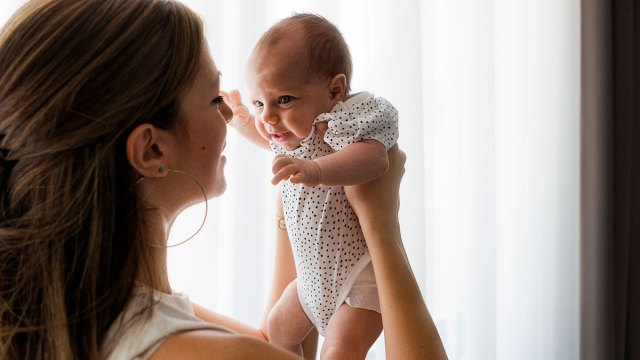 mom holding new baby