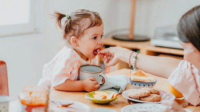 toddler eating all their dinner