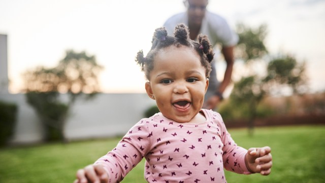 toddler running toward the camera, one of the best family photo ideas with toddlers