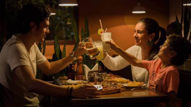 family having dinner together at restaurant