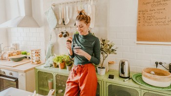 mom eating a snack in the kitchen