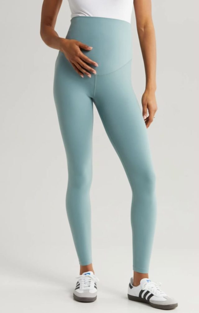 woman standing in grey maternity leggings