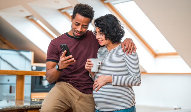 parents at their nesting party discussing digital nesting and their plans for protecting their baby's digital footprint